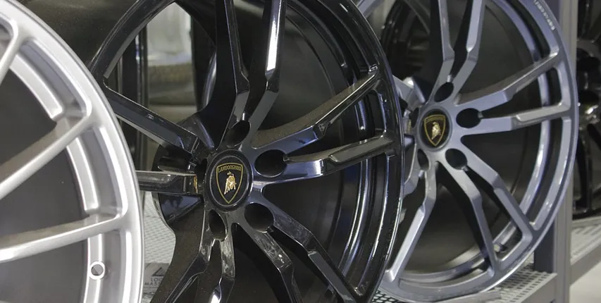 Alloy wheels lined up in a showroom